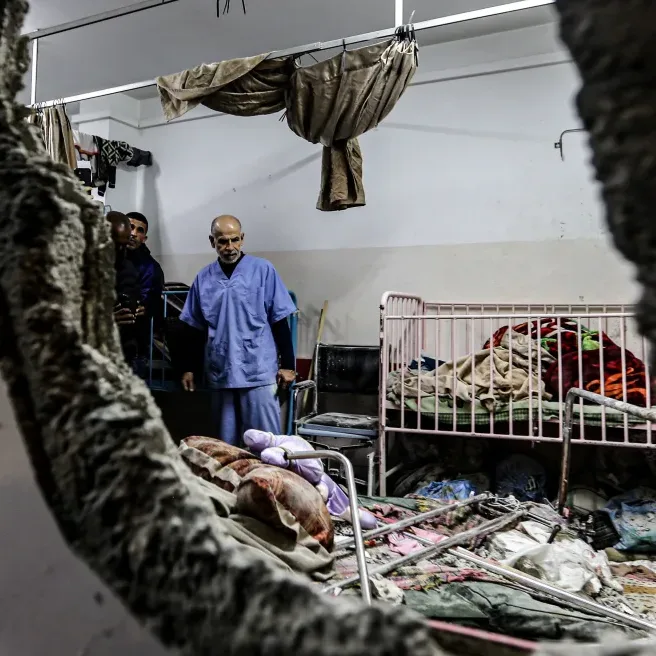 A man inspects the damage after Israeli bombardment at Nasser hospital in Khan Yunis in the southern Gaza Strip on December 17, 2023. Photo: AFP